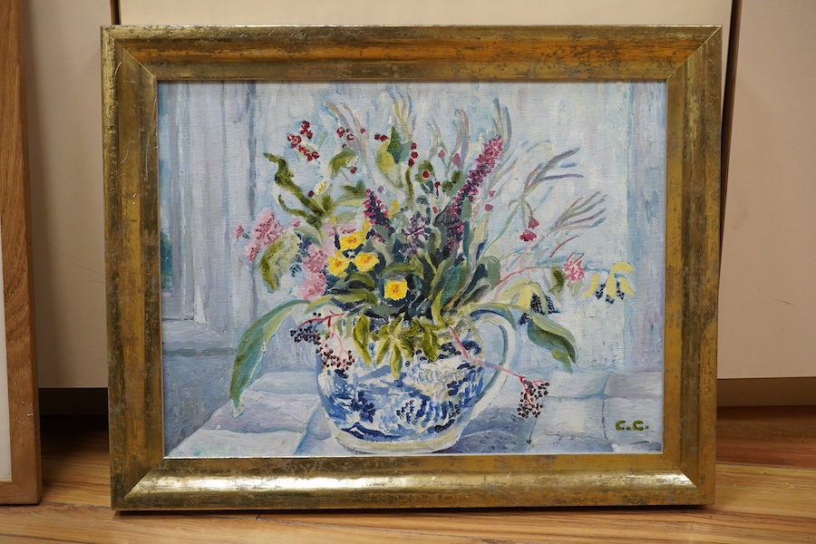 Caroline Conran (b.1939), oil on canvas board, Still life, flowers in a blue and white jug, signed with initials, 29.5 x 39cm, together with two watercolours comprising Still life, Green tomatoes and still life of flower